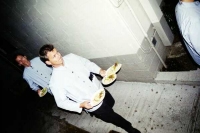 Servers walk quickly into the tents