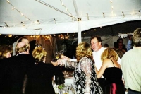 Guests cheer to the thunder and lighting outside