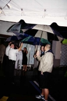 A gauntlet of staff with umbrellas