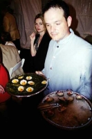 Waiters offer the guests a steady flow of food