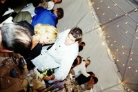 A waiter serves a glass of wine