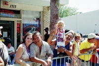 Latino couple & families enjoy their parade